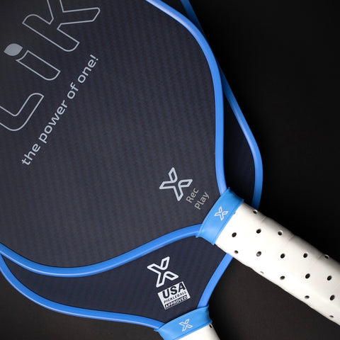 Close up of FLiK Pickleball paddles showing Rec Play vs USAP