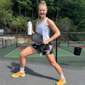 jocelyn holding body helix X4 carbon pickleball paddle and insulated water bottle