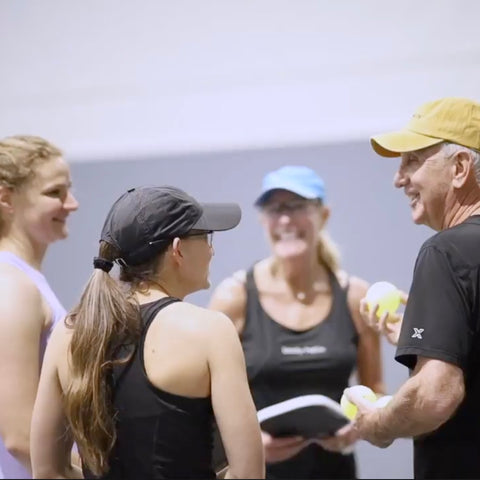 fred talking to 3 women pickleball players